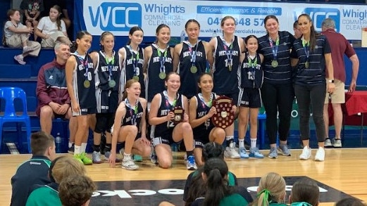 Metropolitan East girls celebrate their win.