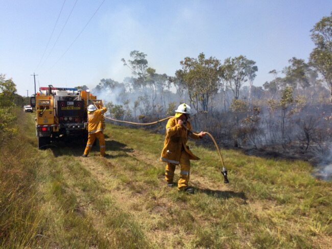 Multiple crews are on the frontlines at Noosa North Shore battling a blaze which broke out this morning, forcing another evacuation. Photo: Patrick Woods/Sunshine Coast Daily