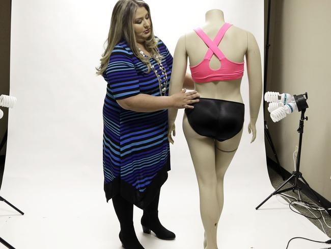 Jessica Asmar, owner of Feel Foxy, repositions a mannequin wearing a pair of padded panties. Asmar says 2014 has been its best year since launching nearly a decade ago. Photo: Pat Sullivan