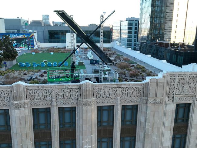 Rebranding … workers install a large X on the roof of Twitter’s San Francisco headquarters in July last year. Picture: Getty Images