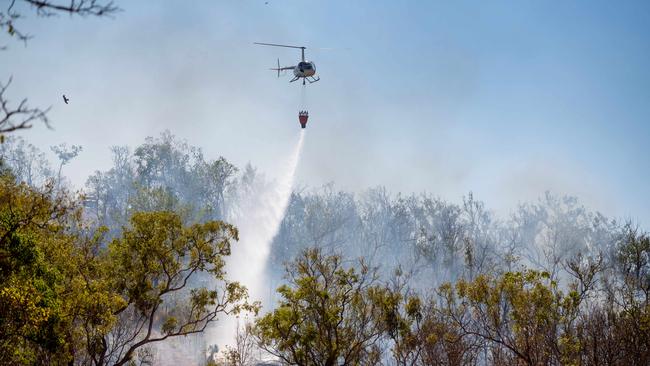 Darwin's rural areas have seen a series of bushfires during the NT's worst fire rating days of the past two years. More extreme fire days are expected later in the week. A bushfire threatens homes and properties in the idyllic Lake Bennett region. Multiple helicopters and volunteer fire fighting units battled the blaze for two days. Picture: Che Chorley