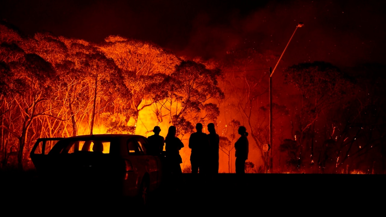 NSW 'like a war zone' as 100 fires burn across the state