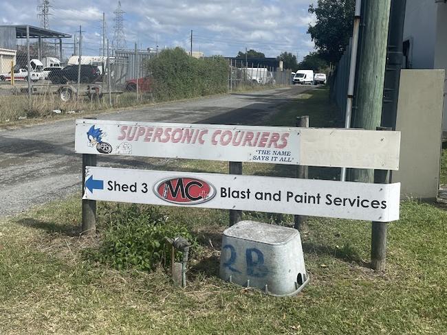 Police are standing guard after a large fire destroyed an industrial shed in West Mackay. Picture: Zoe Devenport