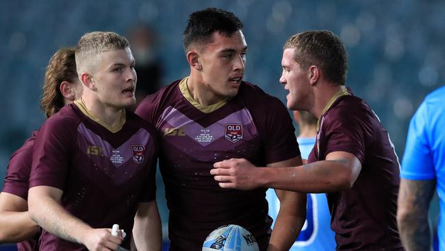 Tino Fa’asuamaleaui (centre) celebrates scoring a try during an under-18s Origin game at the MCG earlier this year. Picture: Adam Head