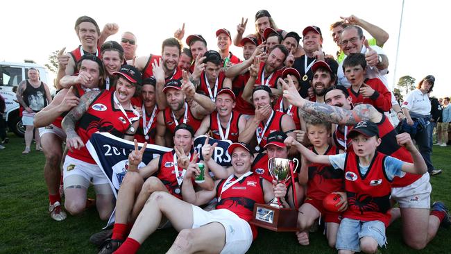 Romsey players get into celebration mode on Sunday. Picture: Mark Dadswell