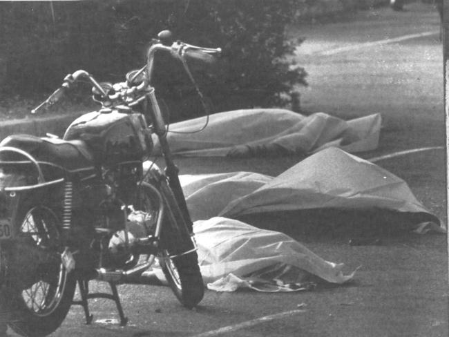 Three of the six dead bikies lay covered outside the Viking Tavern in the wake of the Milperra Massacre.