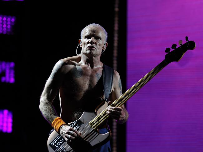 Flea rocking with his guitar. Picture: Jonathan Ng