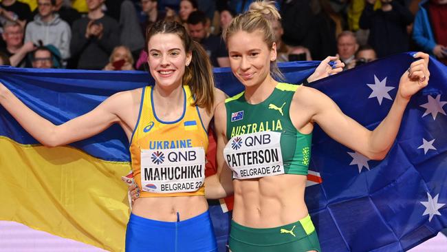 Winner Ukraine's Yaroslava Mahuchikh (L) poses with second placed Australia's Eleanor Patterson after the women's high jump final during The World Athletics Indoor Championships 2022 at the Stark Arena, in Belgrade, on March 19, 2022. (Photo by ANDREJ ISAKOVIC / AFP)