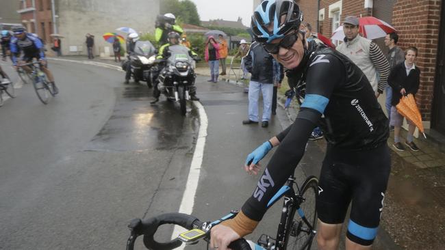 Britain's Christopher Froome grimaces as he gets up after his third crash during the fifth stage of the Tour de France.