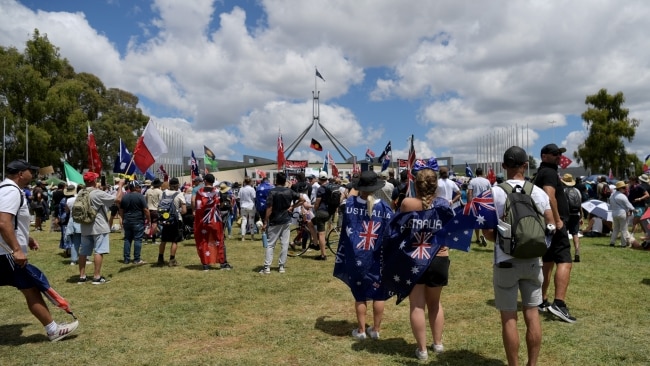 Protesters gather on the lawn of Parliament House on Saturday. Picture: Tracey Nearmy/Getty Images