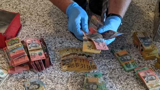 Cops found piles of cash in the Box Hill home