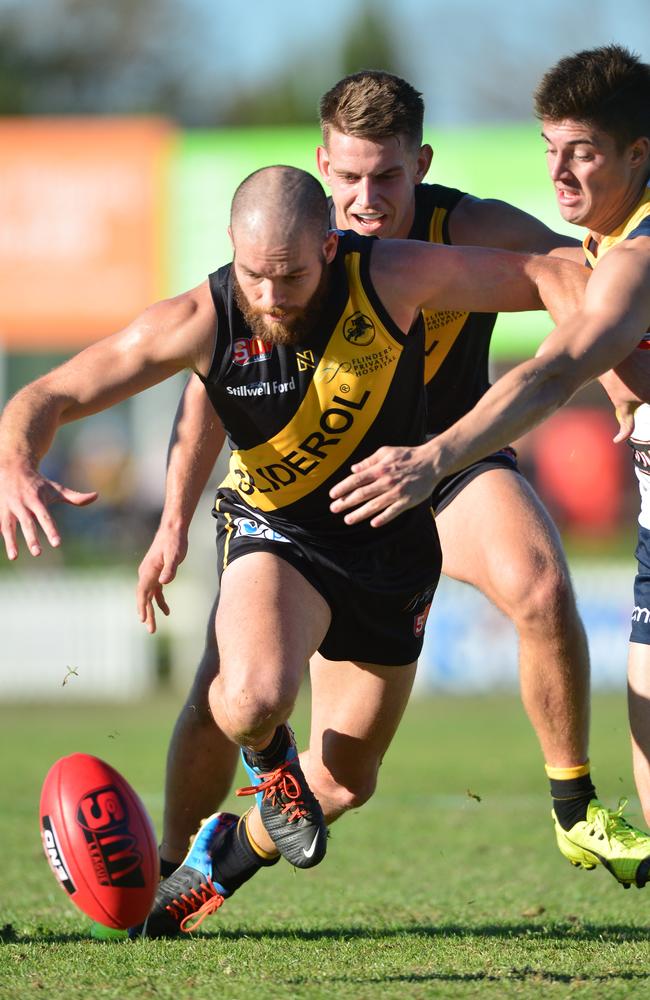 Glenelg's Aaron Joseph over the ball. Picture: Mark Brake