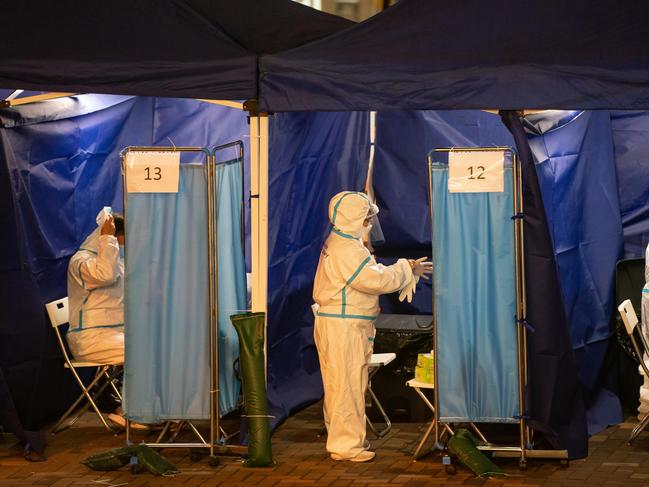 Hong Kong residents get tested for Covid in makeshift stations amid Omicron wave. Picture: Getty Images.