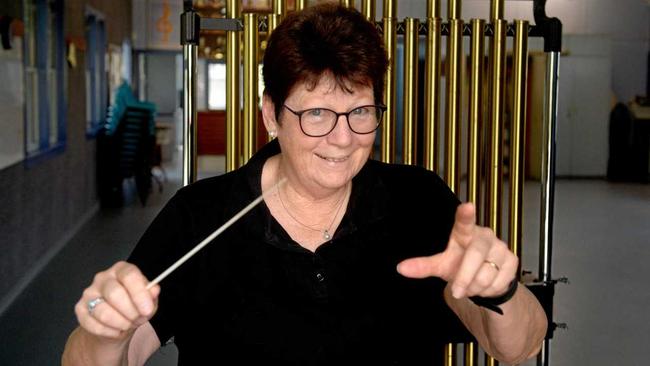 Jeanette Douglas conducts Capricornia Winds at this weekend's concert at Emmaus college. Picture: Jann Houley