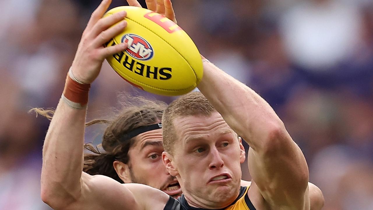 PERTH, AUSTRALIA – MARCH 29: Reilly O'Brien of the Crows and Luke Jackson of the Dockers contest the ruck during the round three AFL match between Fremantle Dockers and Adelaide Crows at Optus Stadium, on March 29, 2024, in Perth, Australia. (Photo by Paul Kane/Getty Images)