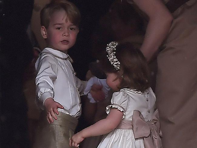 Britain's Prince George (L), a pageboy, Britain's Princess Charlotte, a flower girl, at Aunt Pippa’s wedding. Picture: Supplied