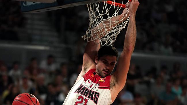 Todd Blanchfield hangs from the net in a rare highlight for the Hawks.