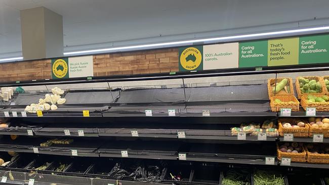 Empty fruit and veg shelves at Woolworths in Gordon.