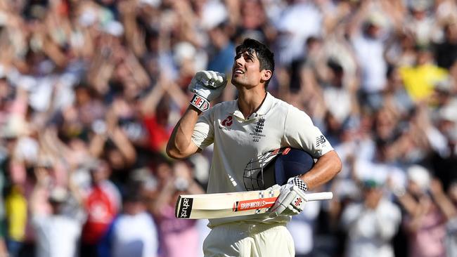 England's batsman Alastair Cook celebrates his century at the MCG yesterday