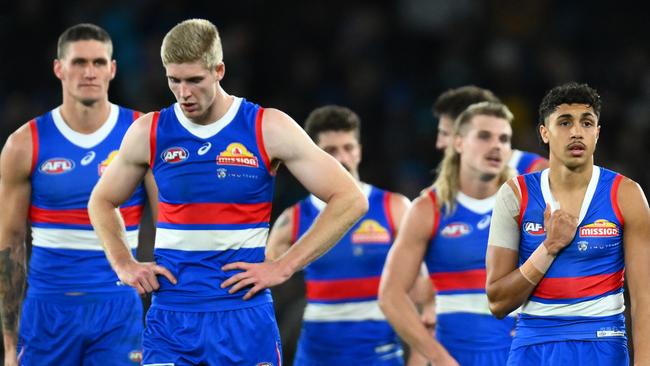 MELBOURNE, AUSTRALIA - JUNE 09: The Bulldogs look dejected after losing the round 13 AFL match between Western Bulldogs and Port Adelaide Power at Marvel Stadium, on June 09, 2023, in Melbourne, Australia. (Photo by Quinn Rooney/Getty Images)