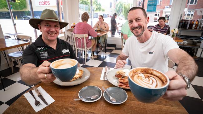 David Cunningham (left) and Bernie Meares enjoy a coffee at The Proprietor Cafe in Albury without having to worry about wearing a face mask. Picture: Simon Dallinger