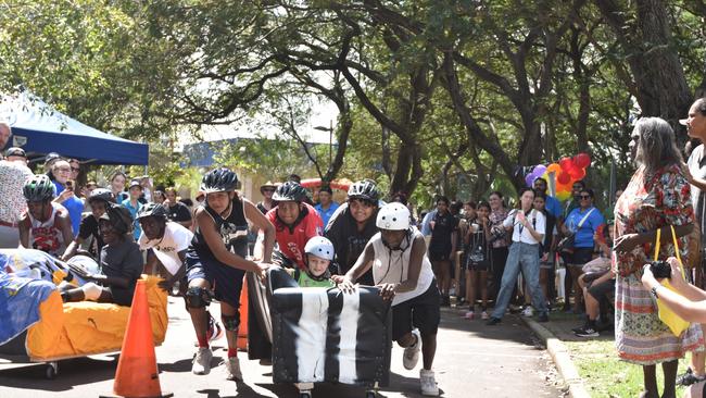 The 'Palmy Army' from the Palmerston Youth Drop In Centre, led by Lorenzo Retchford (left) at Anglicare NT and the City of Darwin's Couch Surfing races 2024. Picture: Alex Treacy