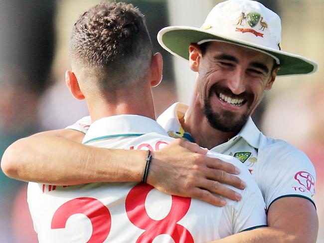 SYDNEY, AUSTRALIA - JANUARY 05: Josh Hazlewood of Australia celebrates the wicket of Salman Ali Agha of Pakistan  with Mitchell Starc on Jane McGrath Day during day three of the Men's Third Test Match in the series between Australia and Pakistan at Sydney Cricket Ground on January 05, 2024 in Sydney, Australia. (Photo by Mark Evans/Getty Images)