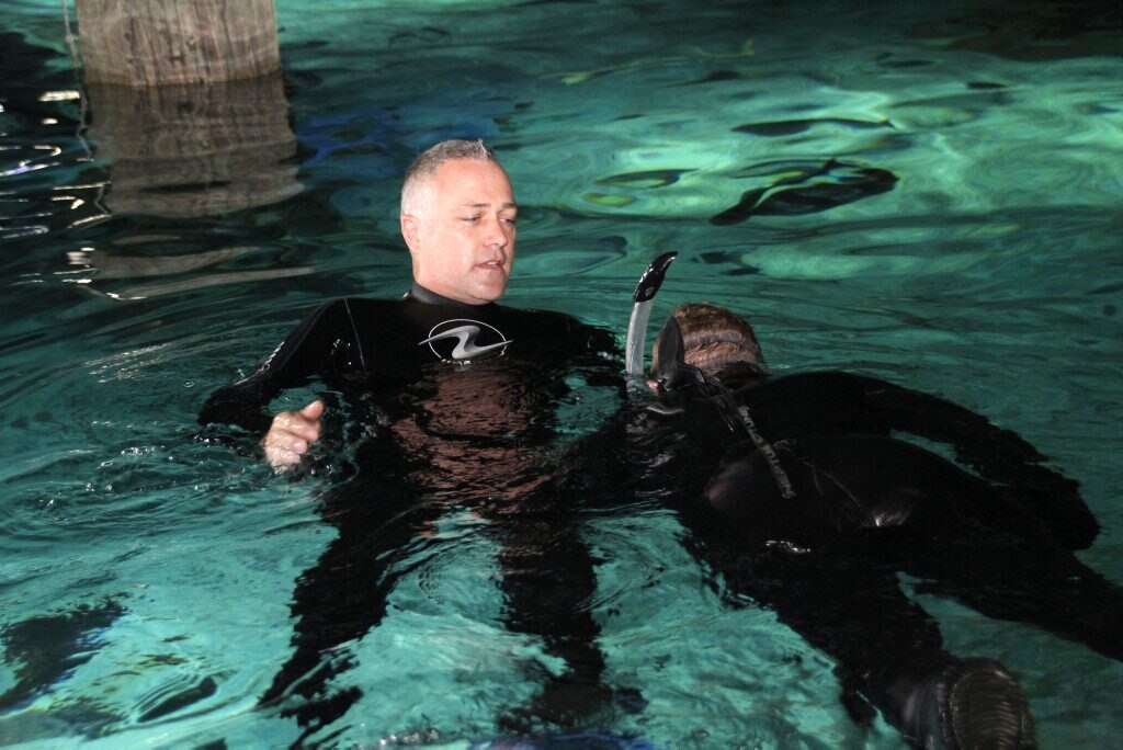 Colby Speare recently spent 506 consecutive days in hospital fighting leukemia. He missed birthdays and Christmas. His parents along with Merlin's Magic Wand have given him a birthday surprise of swimming with the sharks at Sea Life Mooloolaba. Into the tank with the assistance of Head Diver Ade Lynch Photo: Pete Evans / Sunshine Coast Daily. Picture: Pete Evans