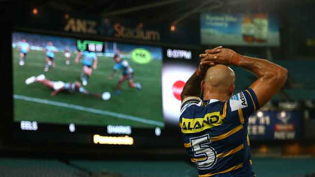 Ferguson watches his blunder on the big screen. (Photo by Matt Blyth/Getty Images)