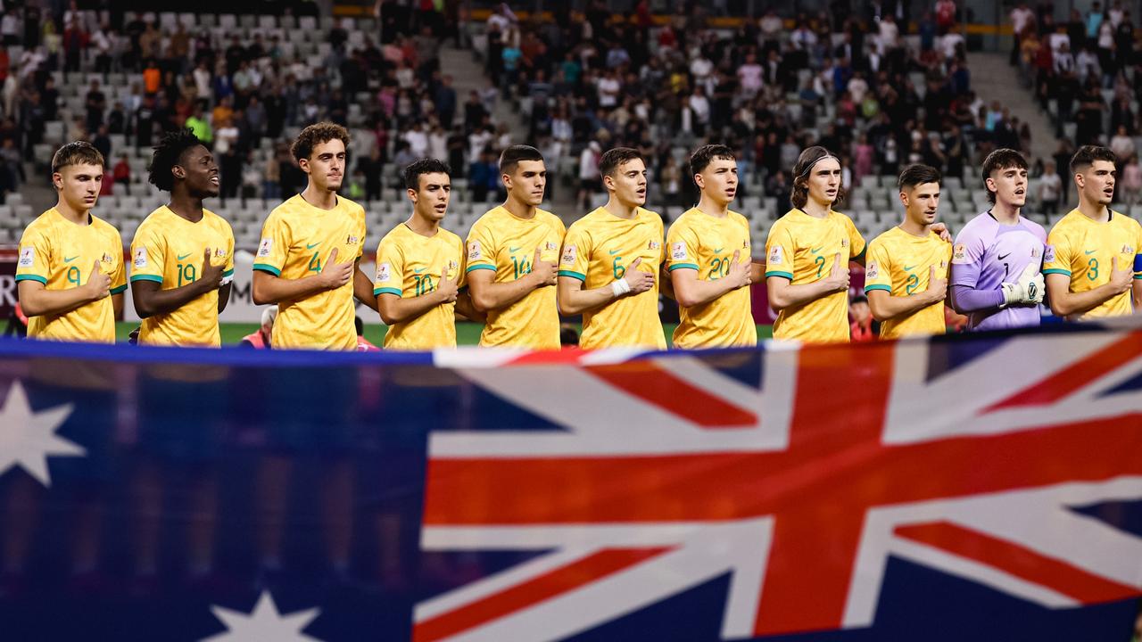 Goalkeeper Steven Hall, second right in the purple goalie jersey, became the nation’s newest footballing hero. Picture: Zhicheng Qin/Football Australia/supplied