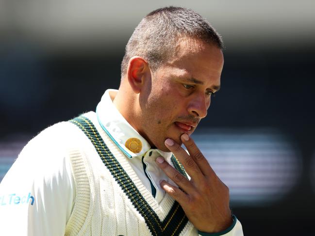 Usman Khawaja leaves the field after being hit in the head. Picture: Paul Kane/Getty Images)