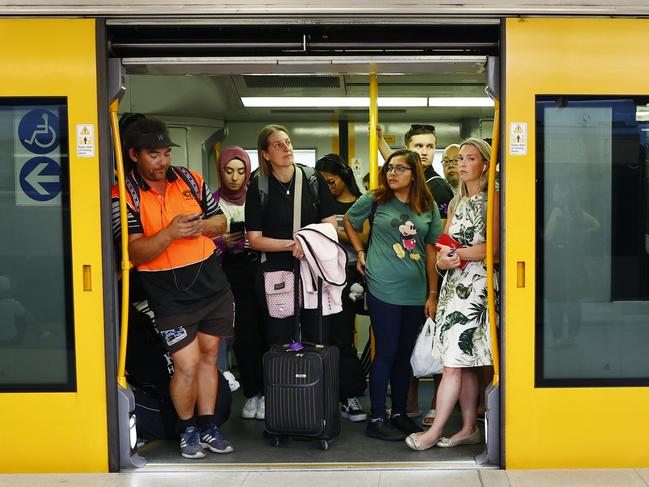 Pictured are commuters waiting patiently for a delayed train to leave the platform at Central Station in Sydney on Wednesday. Picture: Richard Dobson