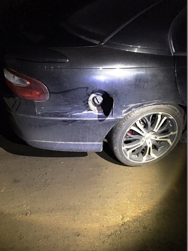 Damage caused after a sedan failed to stop at a level crossing near Westbury and collided with a train carriage.