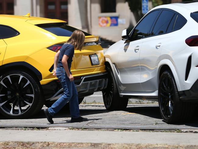 Ben Affleck’s son Samuel inspecting the alleged collision at 777 Exotics luxury car dealership. Picture: Juliano/X17online.com