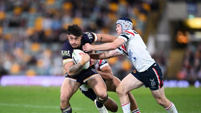 Broncos star Kotoni Staggs is tackled by Roosters' Luke Keary. Picture: NRL Photos