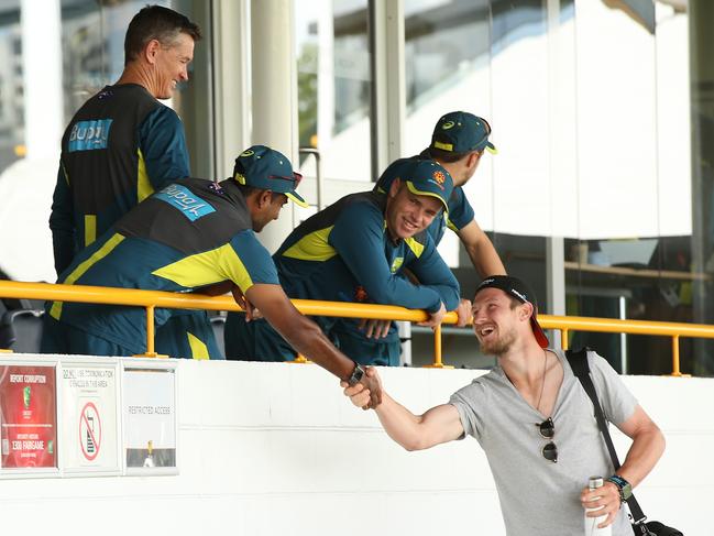 Cameron Bancroft greets Australian players and staff during an Australian training session at the WACA ahead of the Second Test match in the series between Australia and India on December 12. Picture: Getty Images