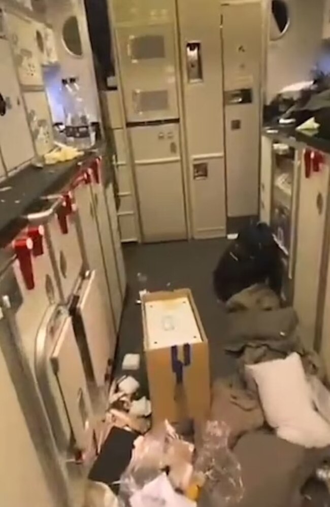 Pillows can be seen on the floor with other aircraft compartments after crew and passengers experienced severe turbulence. Picture: X/Twitter