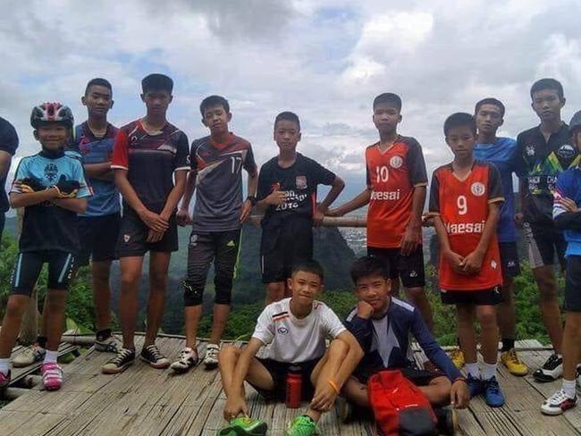 Ekkapol Chantawong and the Moo Pa soccer boys who he hoped to help become professional athletes. Picture: Nopparat Khanthawong.