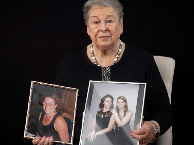 Holocaust survivor Barbara Wojnarowska-Gautier, 84, who was born in Warsaw on January 17, 1941, poses with photographs of her daughter Joanna (left) and granddaughters Aleksandra and Karolina (right), at her home in Warsaw. Picture: Wojtek Radwanski/AFP