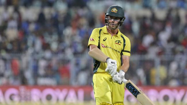 Australia's Travis Head walks back to the pavilion after being dismissed.