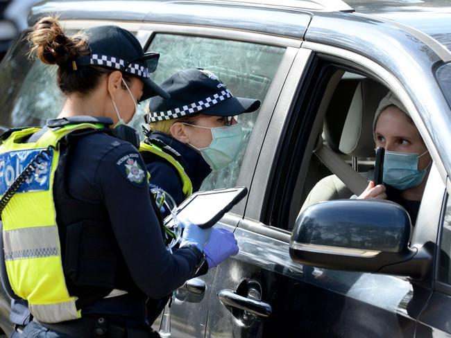 MELBOURNE, AUSTRALIA - NewsWire Photos AUGUST 11, 2020: Police check travel permits at a mobile checkpoint at Eltham in Melbourne's outer north east as stage 4 lockdowns come into effect across the city. Picture: NCA NewsWire / Andrew Henshaw