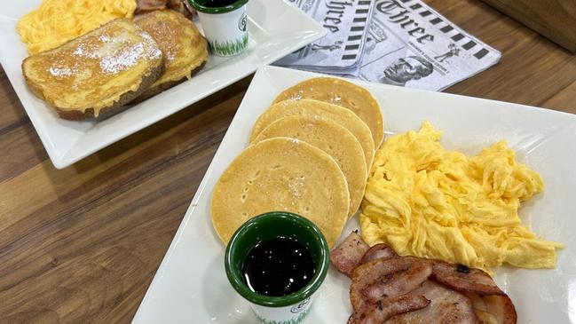 Cafe 63's signature breakfast meals, Samoa (french toast) and Mountie (pancakes) both served with two slices of crispy bacon, delicious scrambled eggs and maple syrup. Picture: Supplied