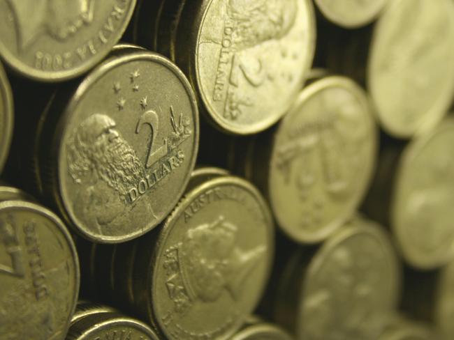 Stacks of Australian $2 coins. Small area of focus towards the left.