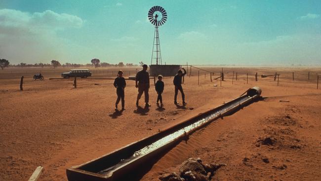 The iconic 1966 drought picture of Cairo station by David Moore. Laurie Wetzel with his three children [L-R] Julie (12), Ruth (8) and Steve (14) inspecting dry drinking troughs.