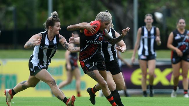 Alex Woodward chases down Skye Graham in round one of the NTFL 22/23 season. Picture: (A)manda Parkinson