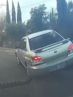 A Subuary Imprezza ploughed into the side of a car before partially mounting another. Picture: Facebook/Dash cam Owners Australia