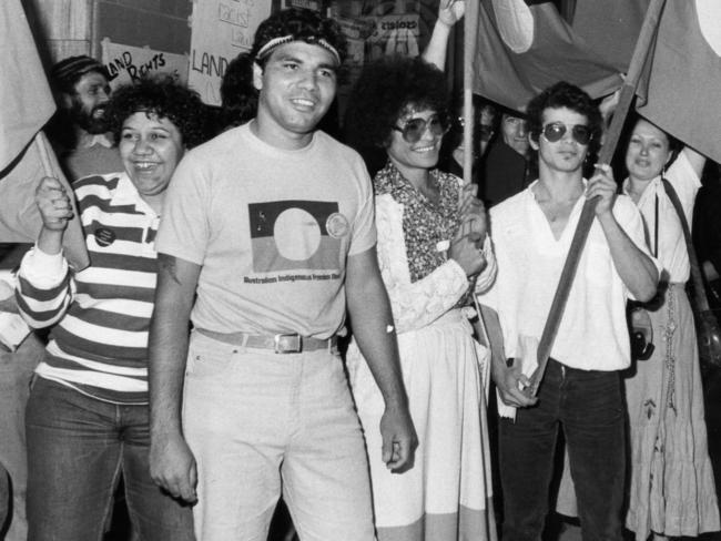 A group of Aboriginal Australians at rally lead by Warren Mundine, chairman of the Justice Before Games support group, demonstrating in front of the Queensland Tourist Bureau office in Grenfell Street, Adelaide 17 Sep 1982.