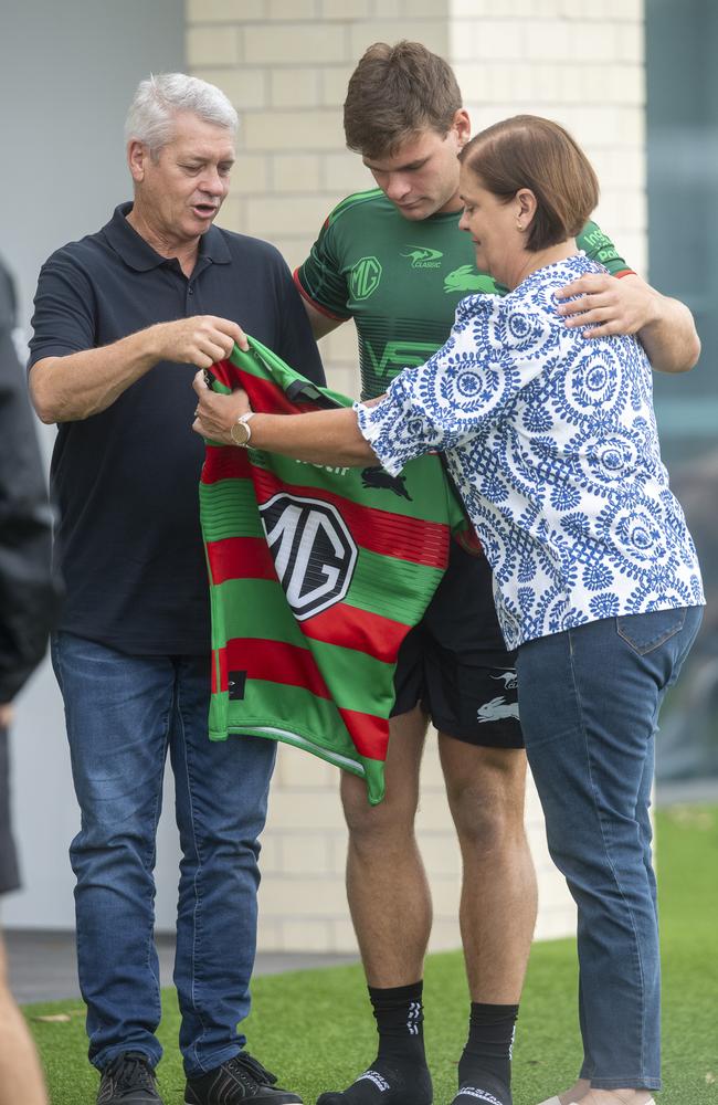 Lachlan Hubner with his parents Jo and Craig at South Sydney NRL training. Picture: Jeremy Piper