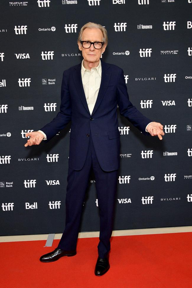 Image credit: Getty Images Bill Nighy in P Johnson Looking dapper as ever reading Joan Didion at a cafe in London, Bill Nighy was wearing one of Australia’s favourite suiting labels, P Johnson. In a 2022 interview with Vogue, Nighy said of the label, “they have an algorithm where they take measurements that no one else has ever taken in the history of tailoring. And they come up and they really can make a beautiful shape. And they’re not obscenely expensive.” Sums it up pretty well to us.
