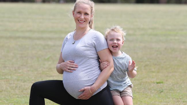 Australian Catholic University exercise physiologist Kassia Beetham, who is 36 weeks pregnant, with her son Rex Beetham, three years. Picture: Annette Dew